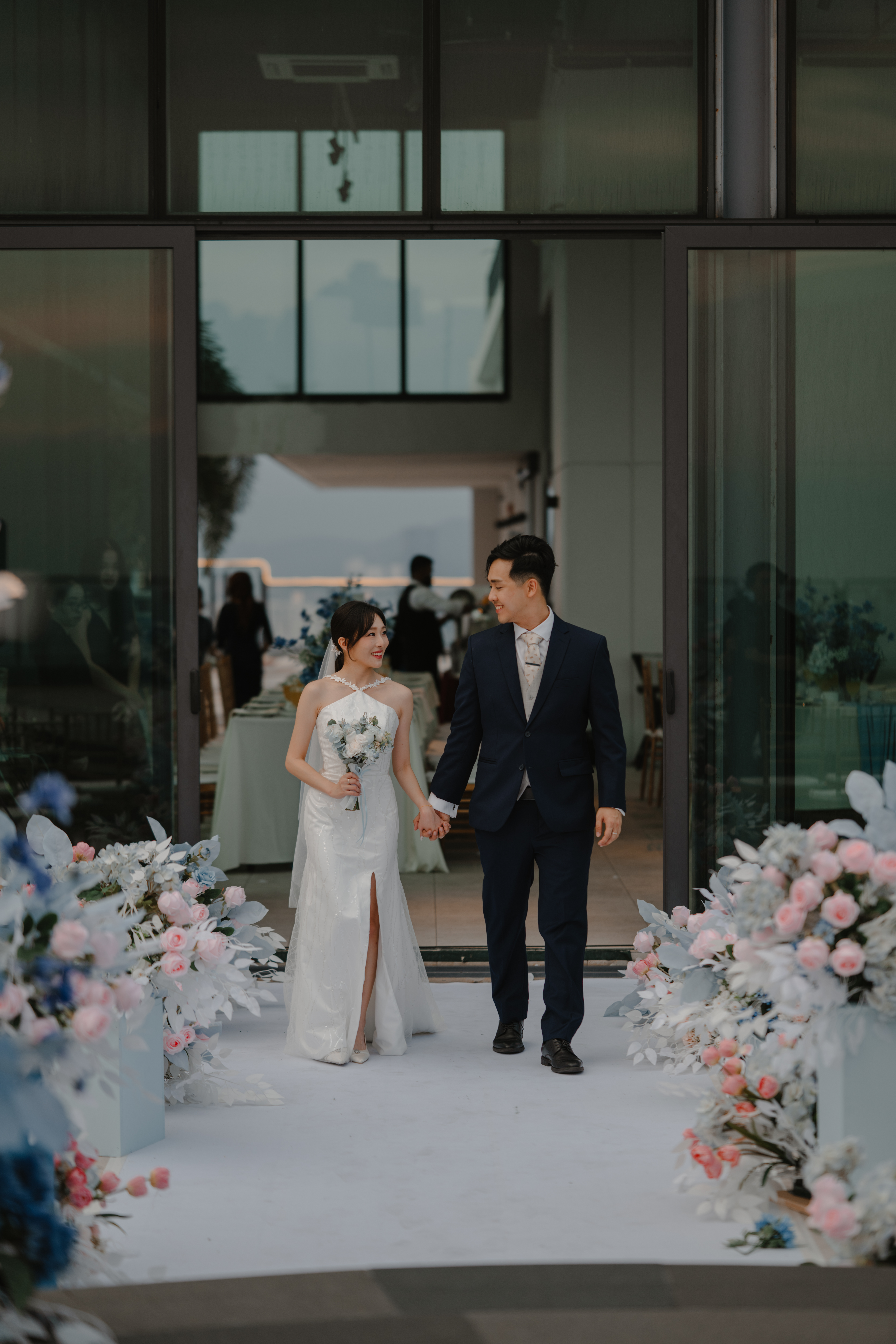 Couple portrait at rooftop wedding with KL skyline backdrop